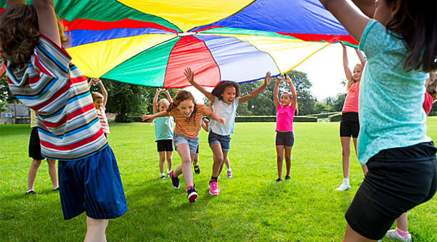 Children playing with parachute.