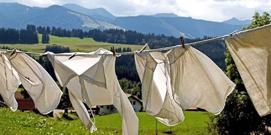 Clothes drying on a washing line in the mountains.