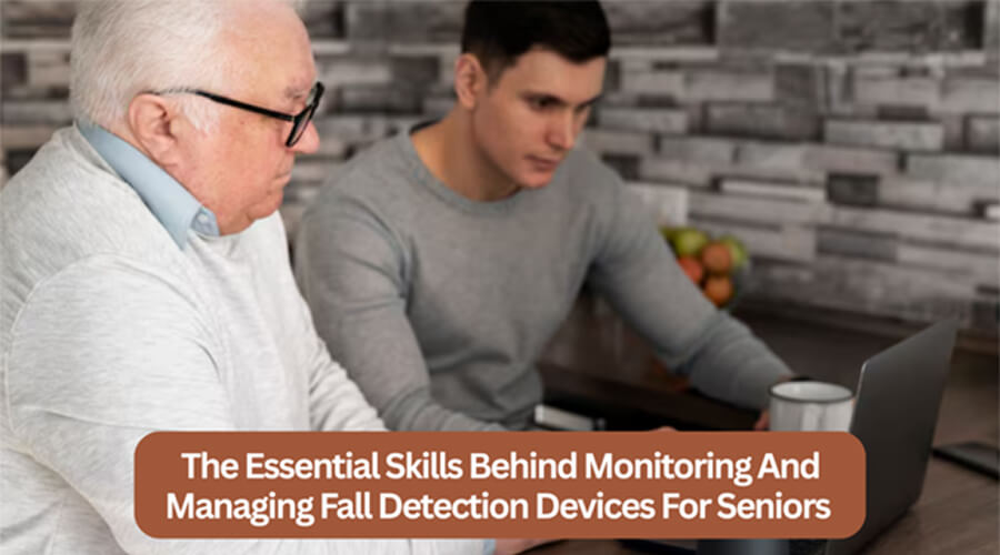 Older man and younger man using a laptop together at a table.