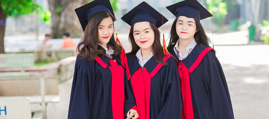 Three young female graduates.