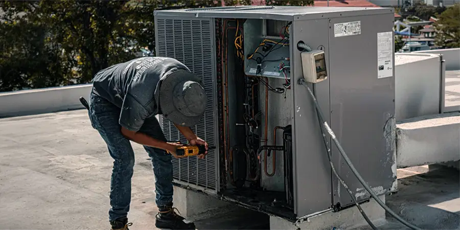 HVAC contractor working on a HVAC unit.
