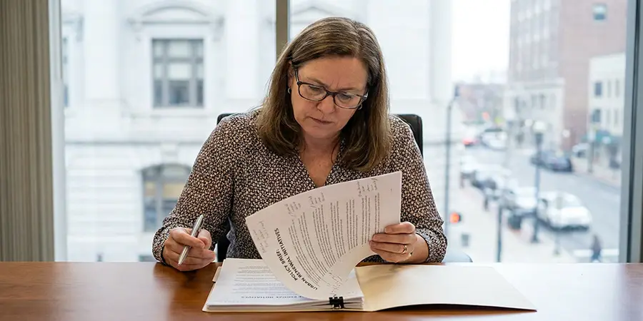 Public administrator annotating a policy brief
