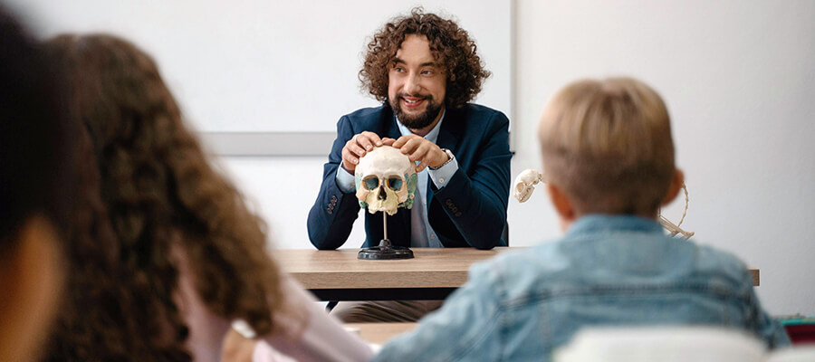 Teacher with a skull and a smile.